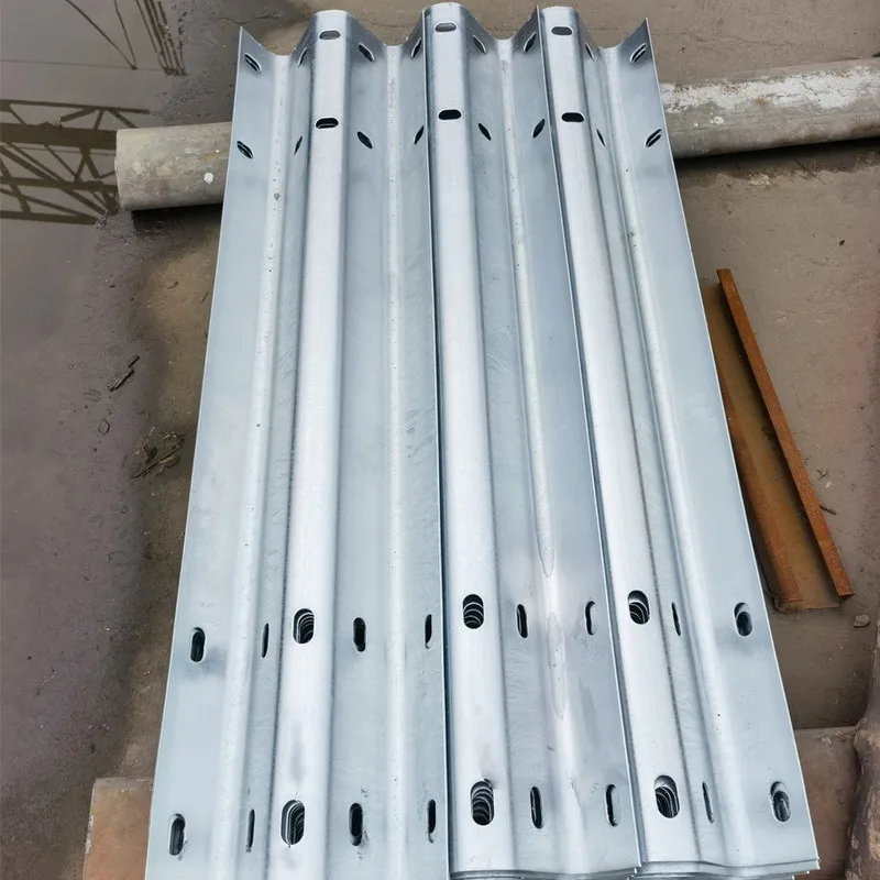 Galvanized Thrie-beam guardrails showing the three-wave profile and bolt holes